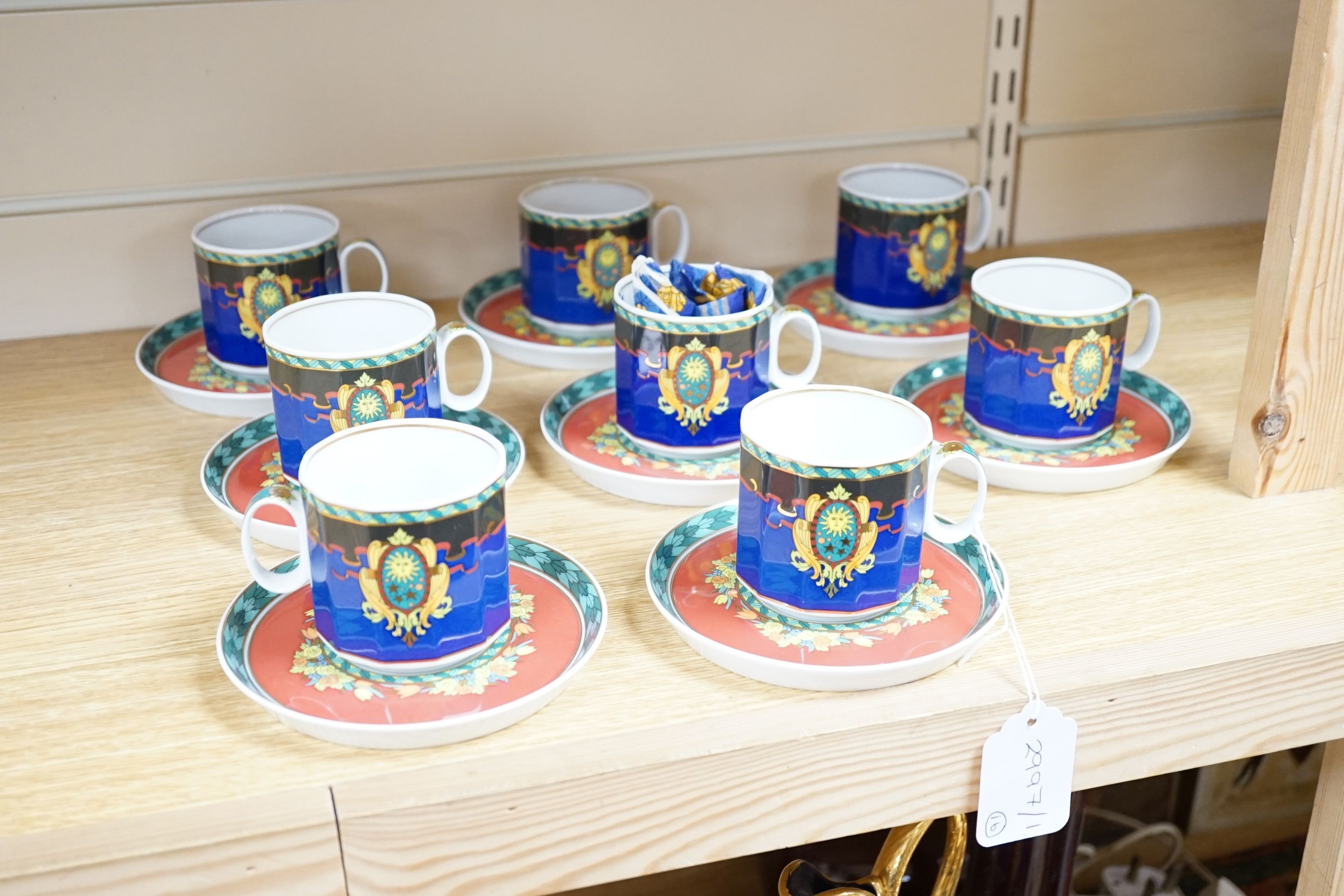 A set of eight Versace 'Le Roi Soleil' pattern cups and saucers